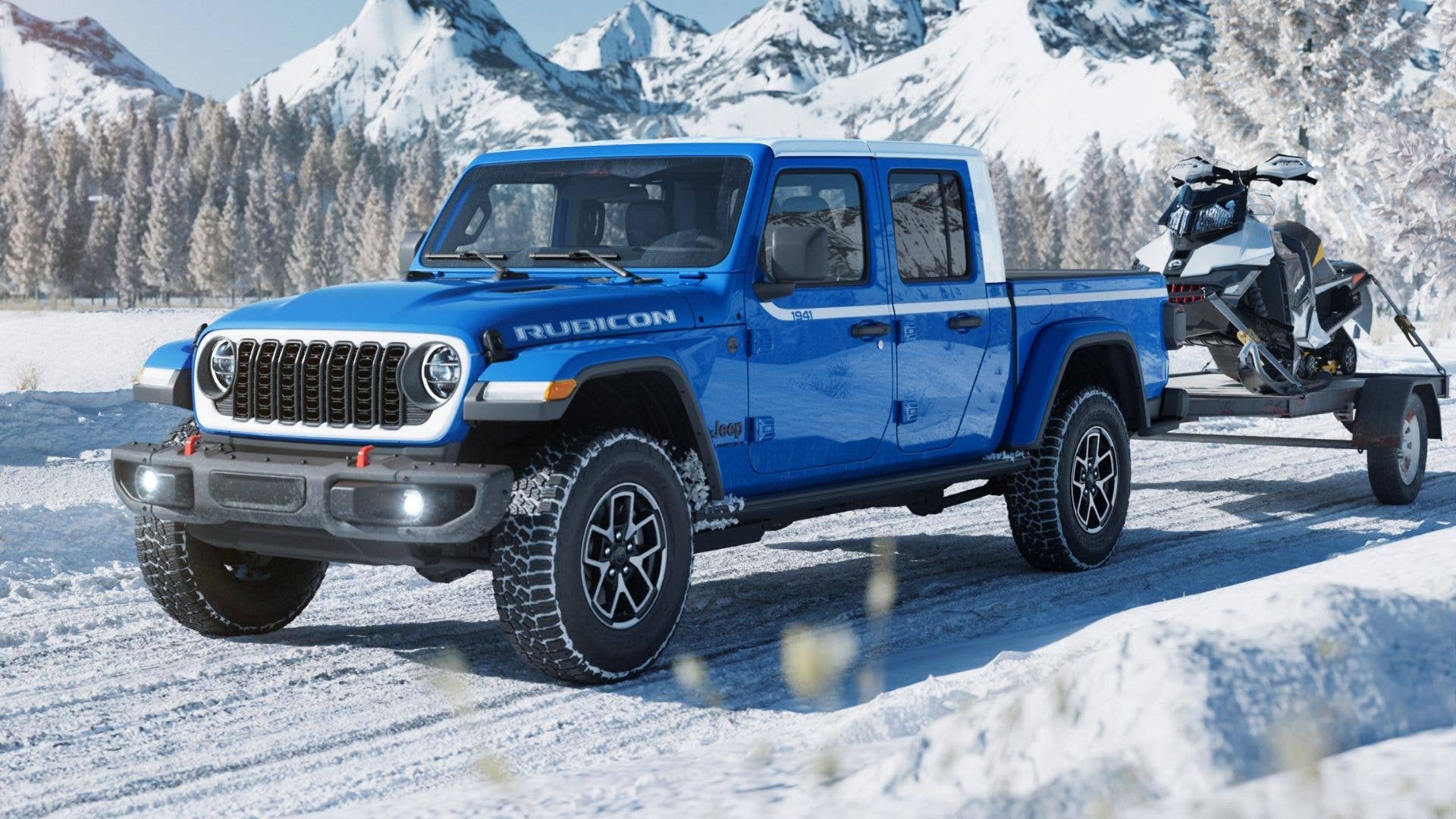 Blue 2026 Jeep Gladiator Whitecap Driving in Snow While Towing Snowmobile