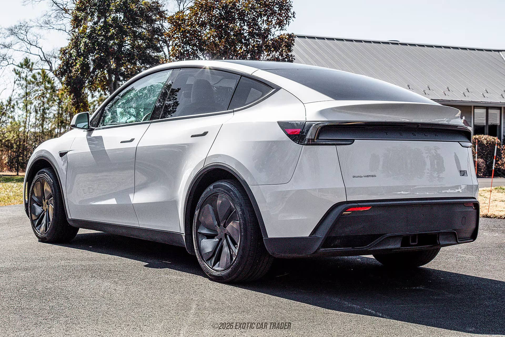 2026 Tesla Model Y Launch Edition in Pearl White rear angled view