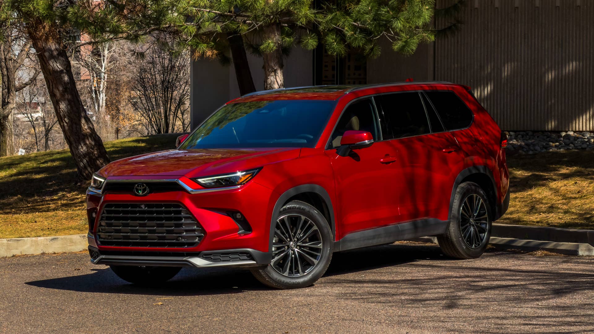 2026 Toyota Grand Highlander Hybrid MAX Platinum in Ruby Flare Pearl front angled view