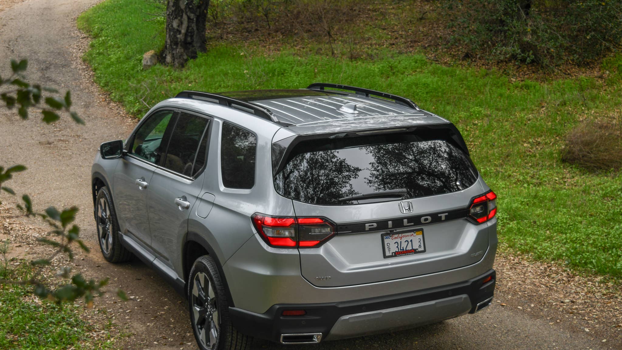 2026 Honda Pilot Elite AWD in Sonic Gray high rear angled view
