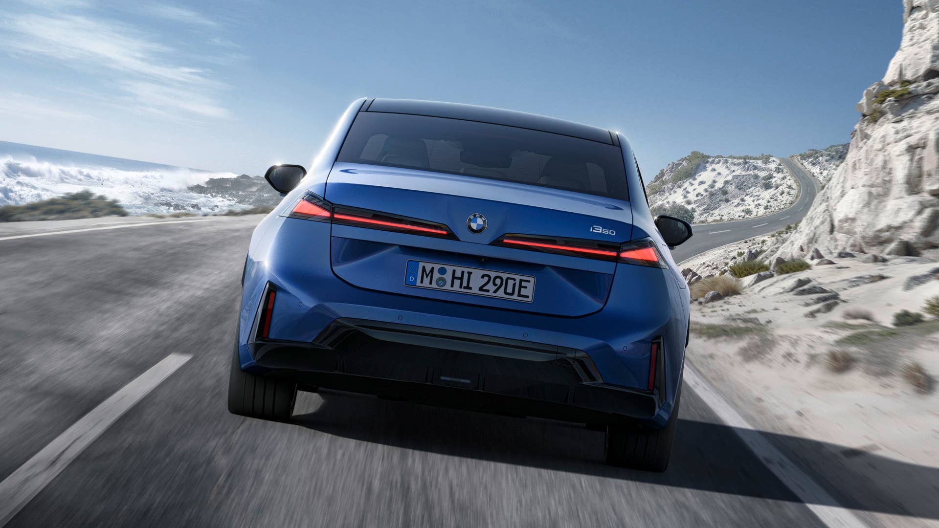 2027 BMW i3 blue rear view driving