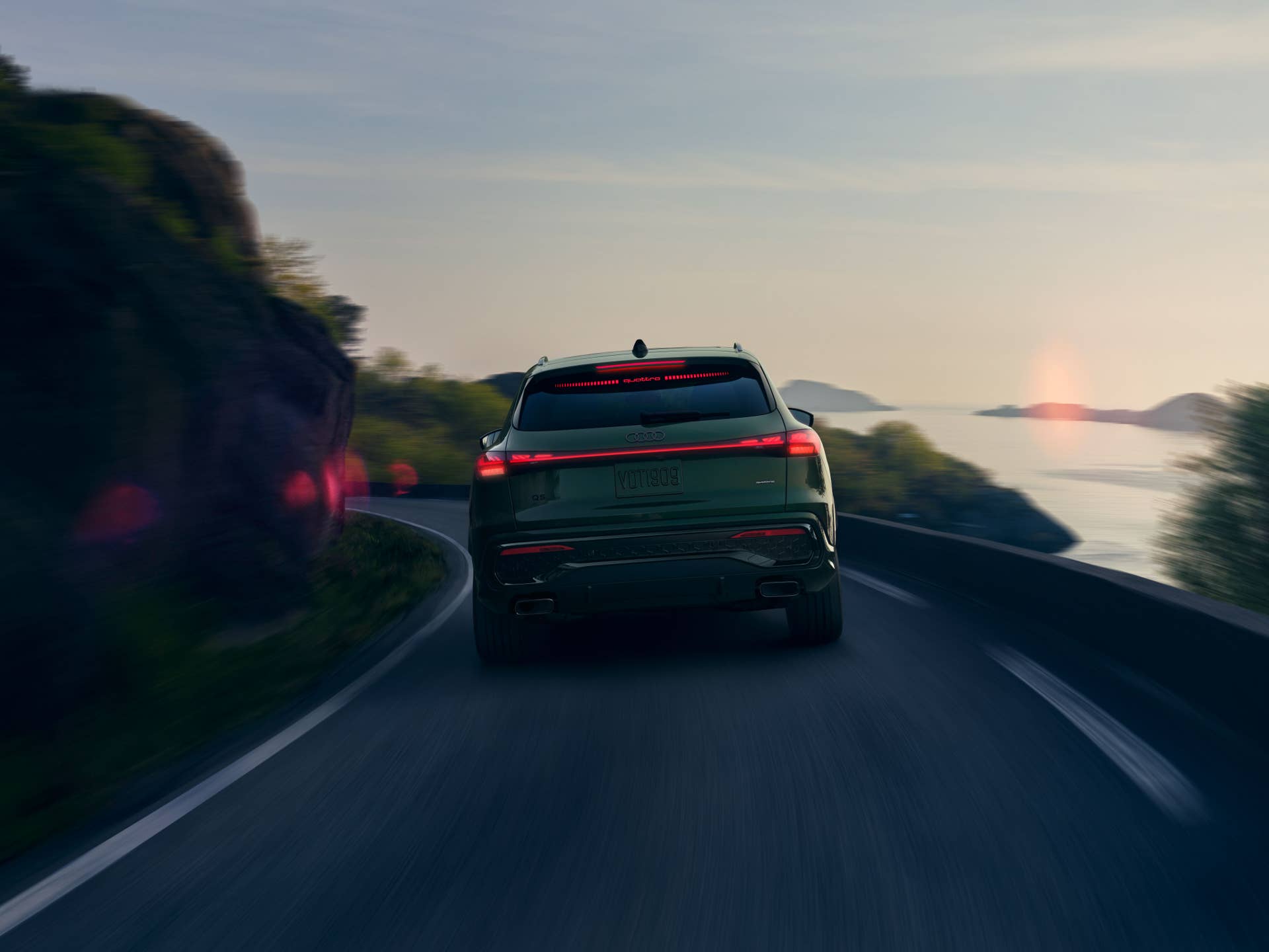 2026 Audi Q5 green rear view driving
