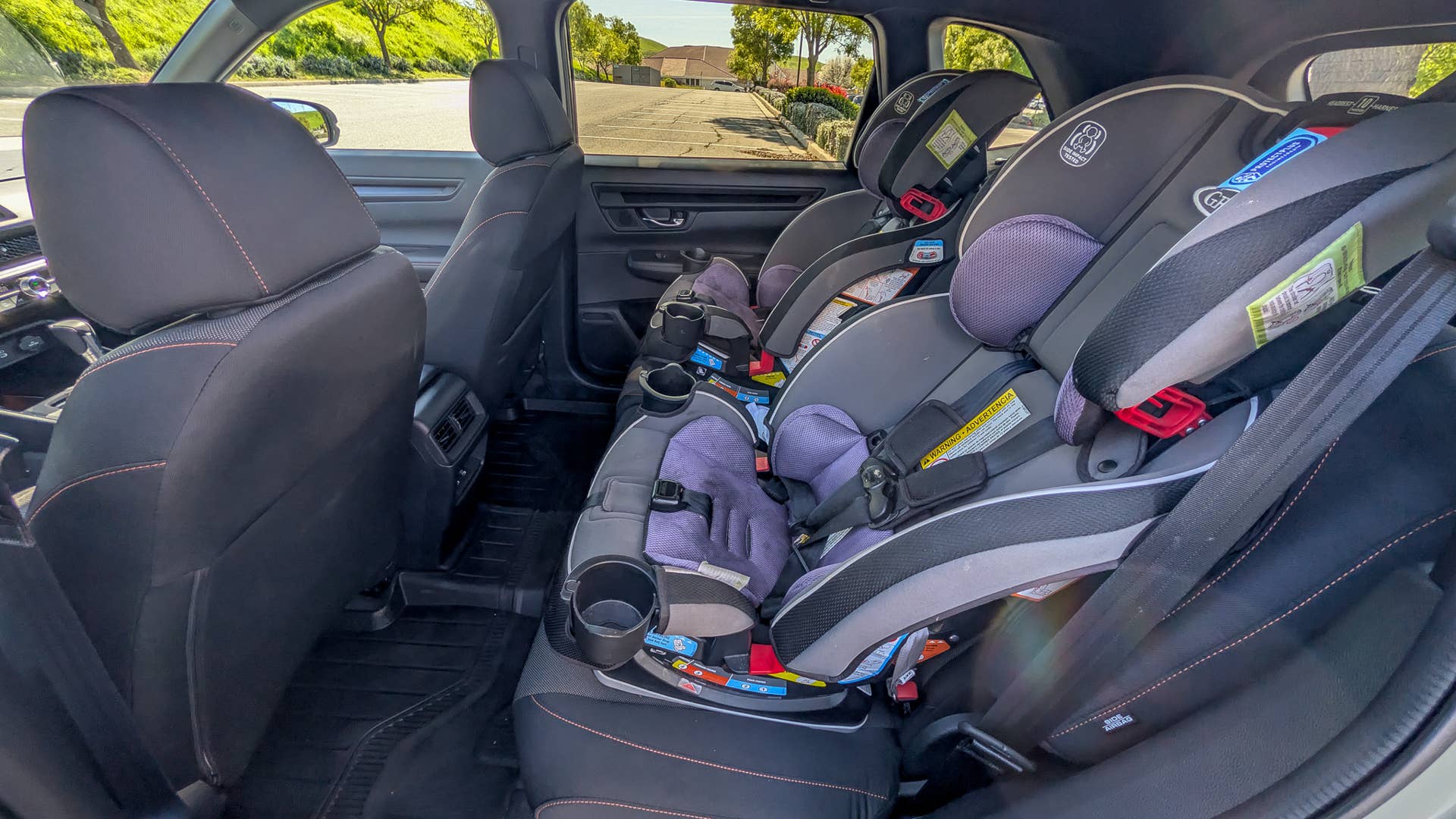 The rear seats of the 2026 Honda CR-V TrailSport Hybrid, with two car seats installed
