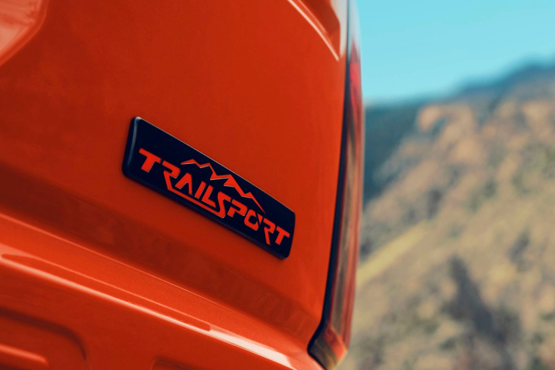 2026 Honda Passport TrailSport in Sunset Orange rear liftgate model script