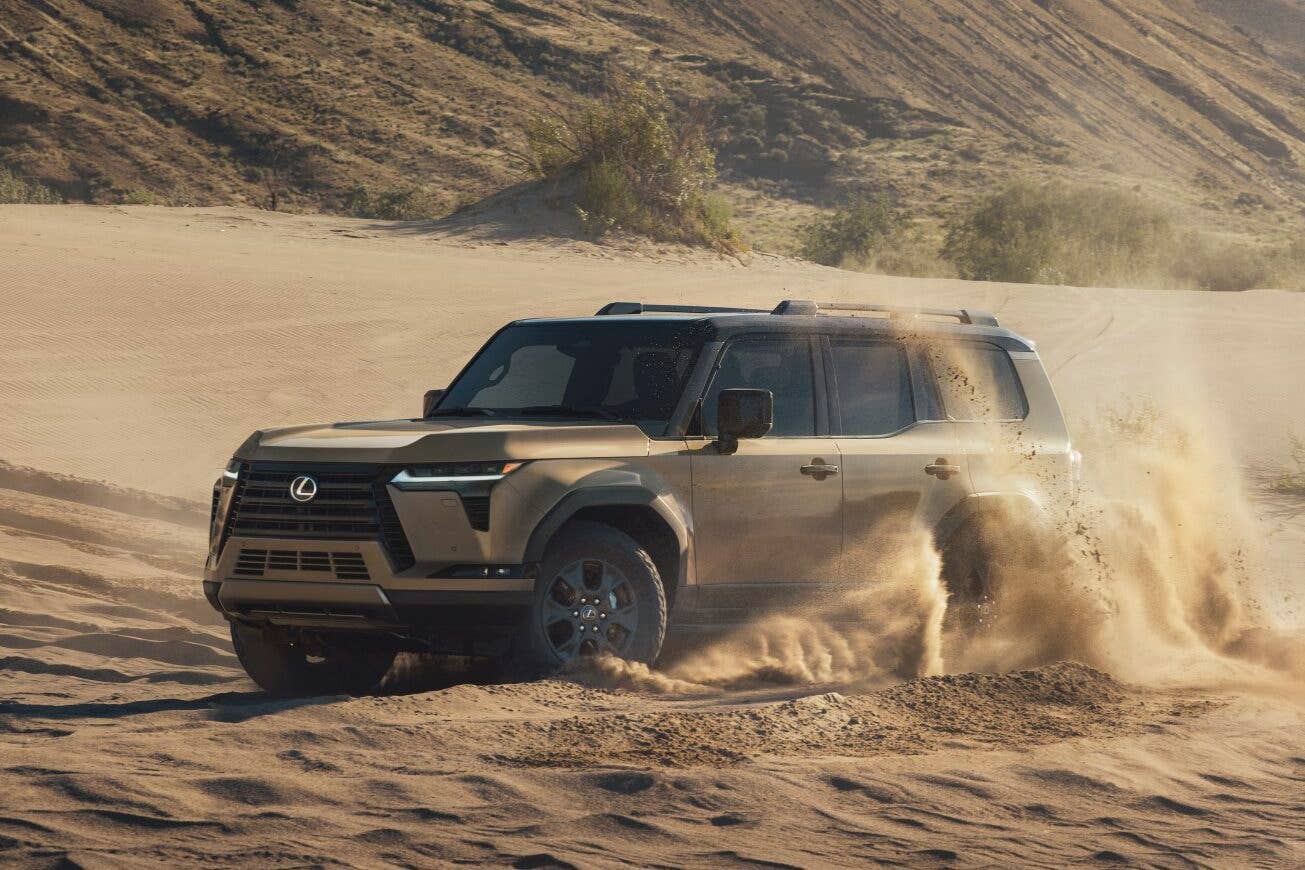 2026 Lexus GX brown front angled view sand driving