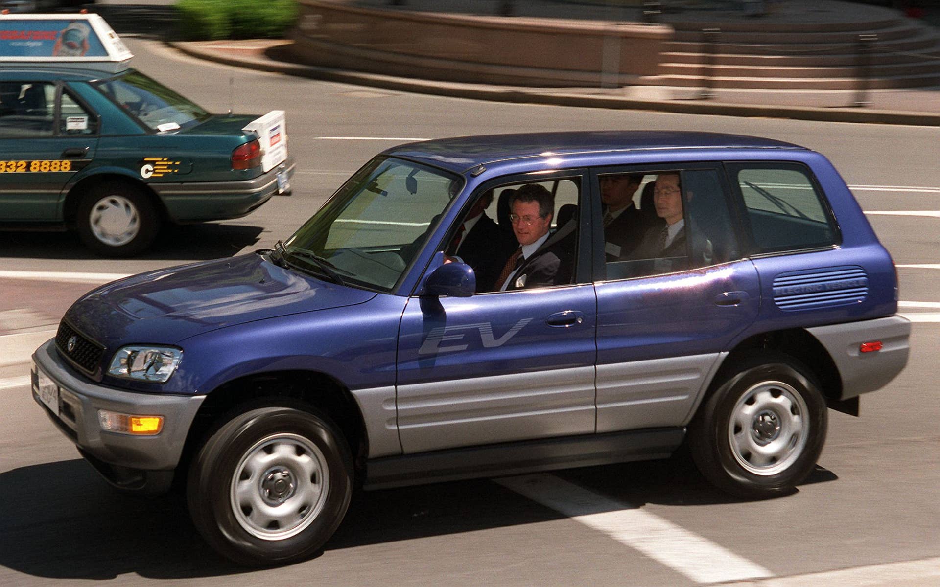 New South Wales Treasurer and Minister for Energy Michael Egan takes the first electric Toyota RAV4 EV in Australia for a spin around the streets of Sydney