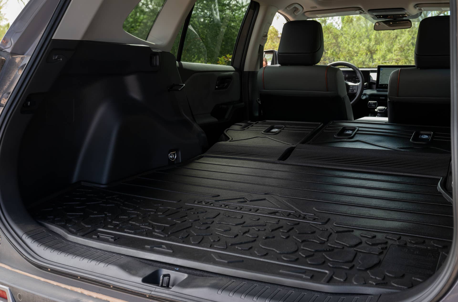 2026 Toyota RAV4 Woodland black interior trunk rear seats folded