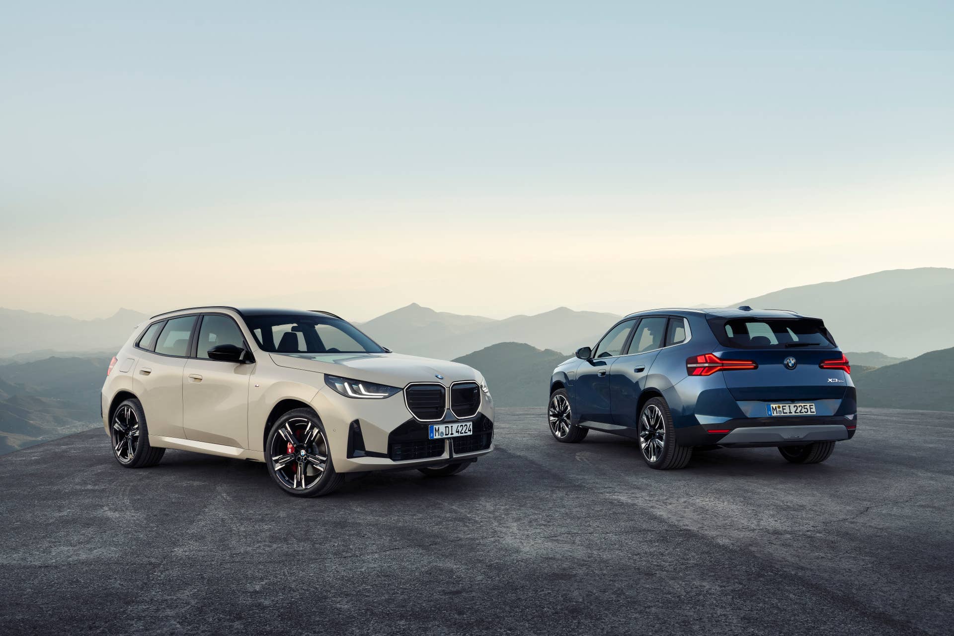 2025-2026 BMW X3 M50 in Alpine White front and 30 xDrive in Arctic Race Blue rear view