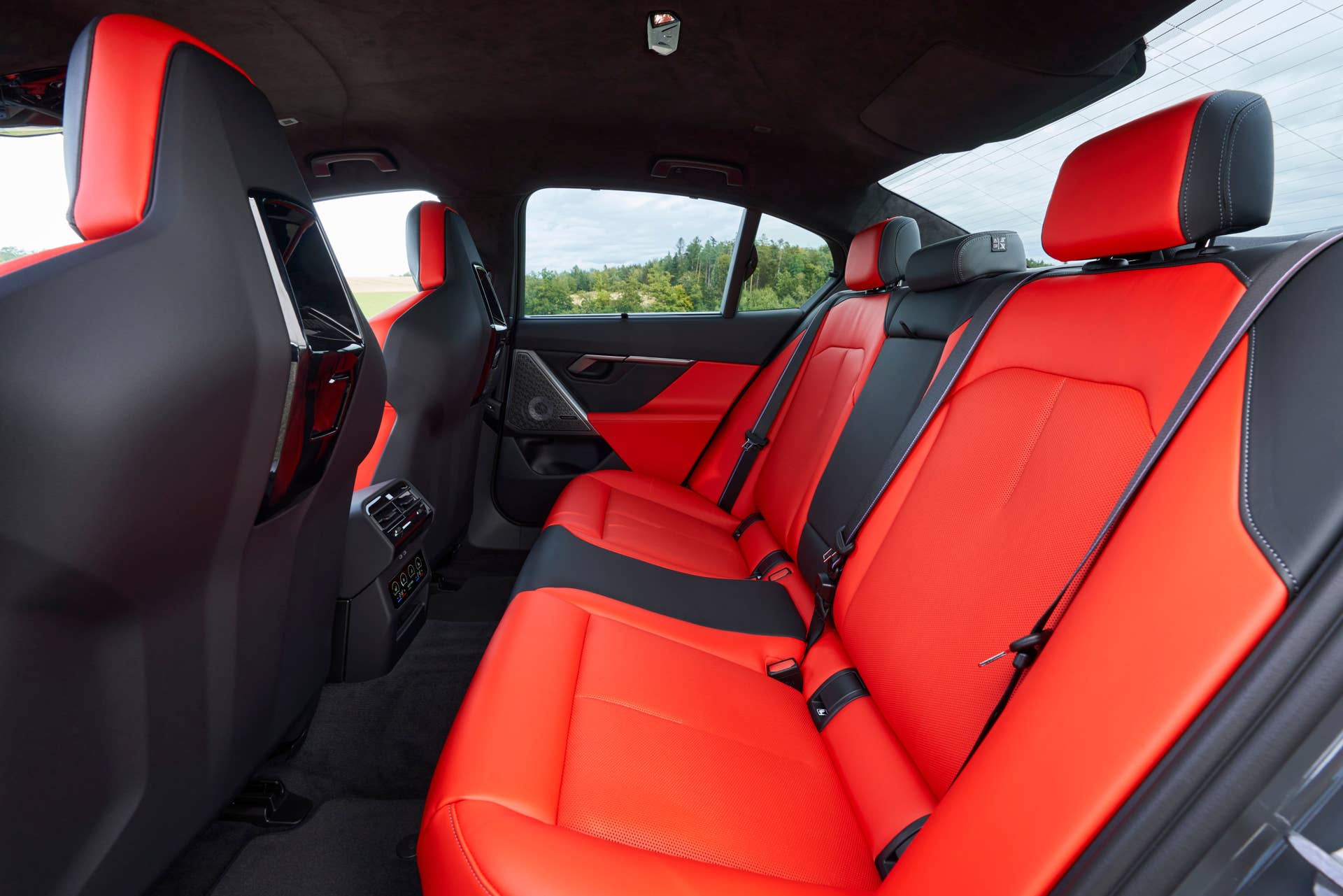2025-2026 BMW M5 Touring with red/black interior rear seats