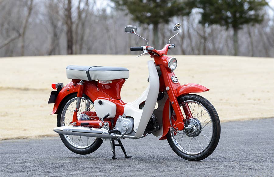 A red and while 1962 Honda Super Cub