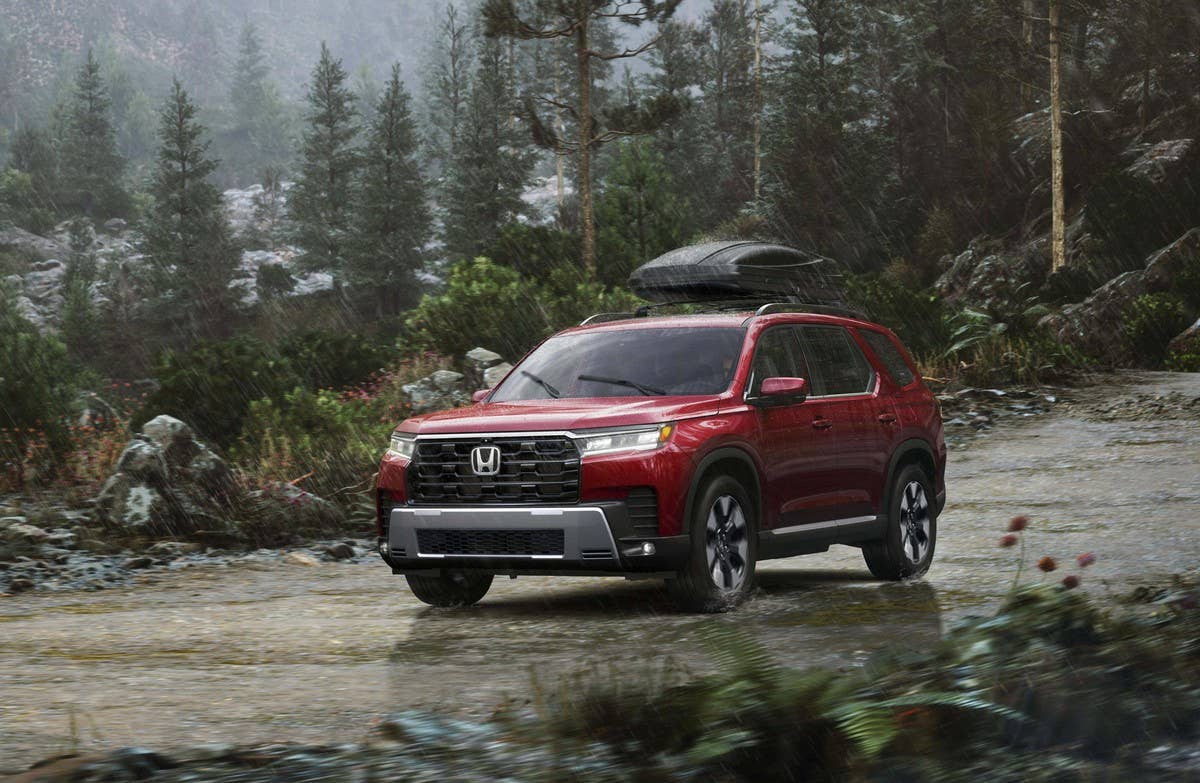 2026 Honda Pilot Elite AWD in Radiant Red Metallic II front angled view