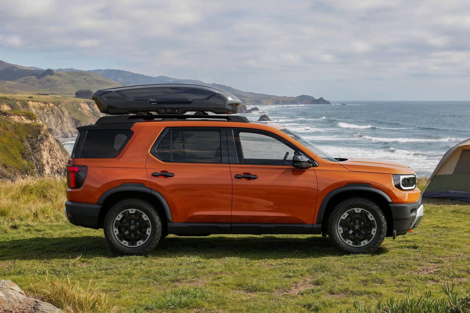 2026 Honda Passport TrailSport in Sunset Orange with Thule roof bin side view
