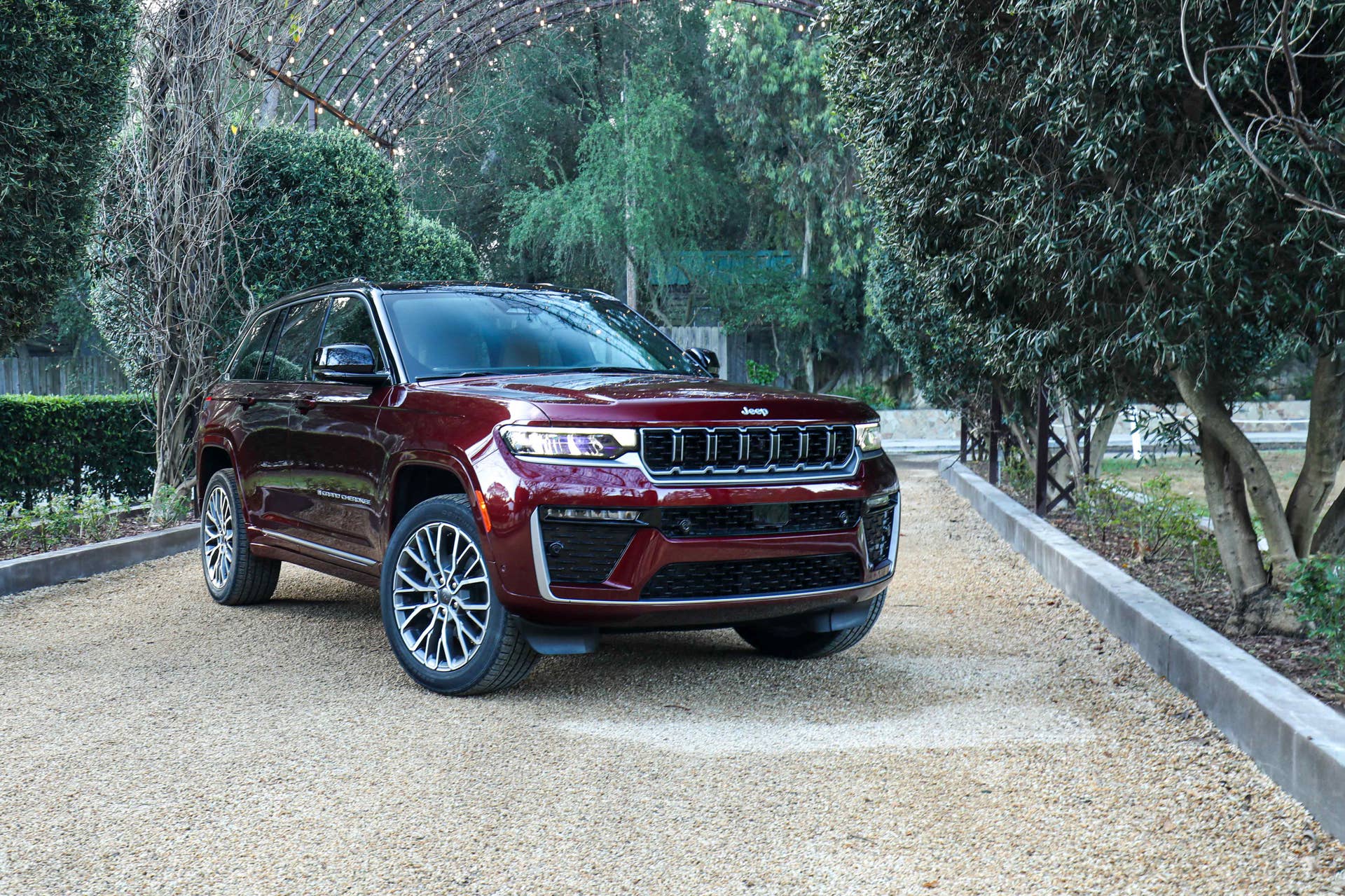 2026 Jeep® Grand Cherokee Summit in Velvet Red and black 2-tone front angled view