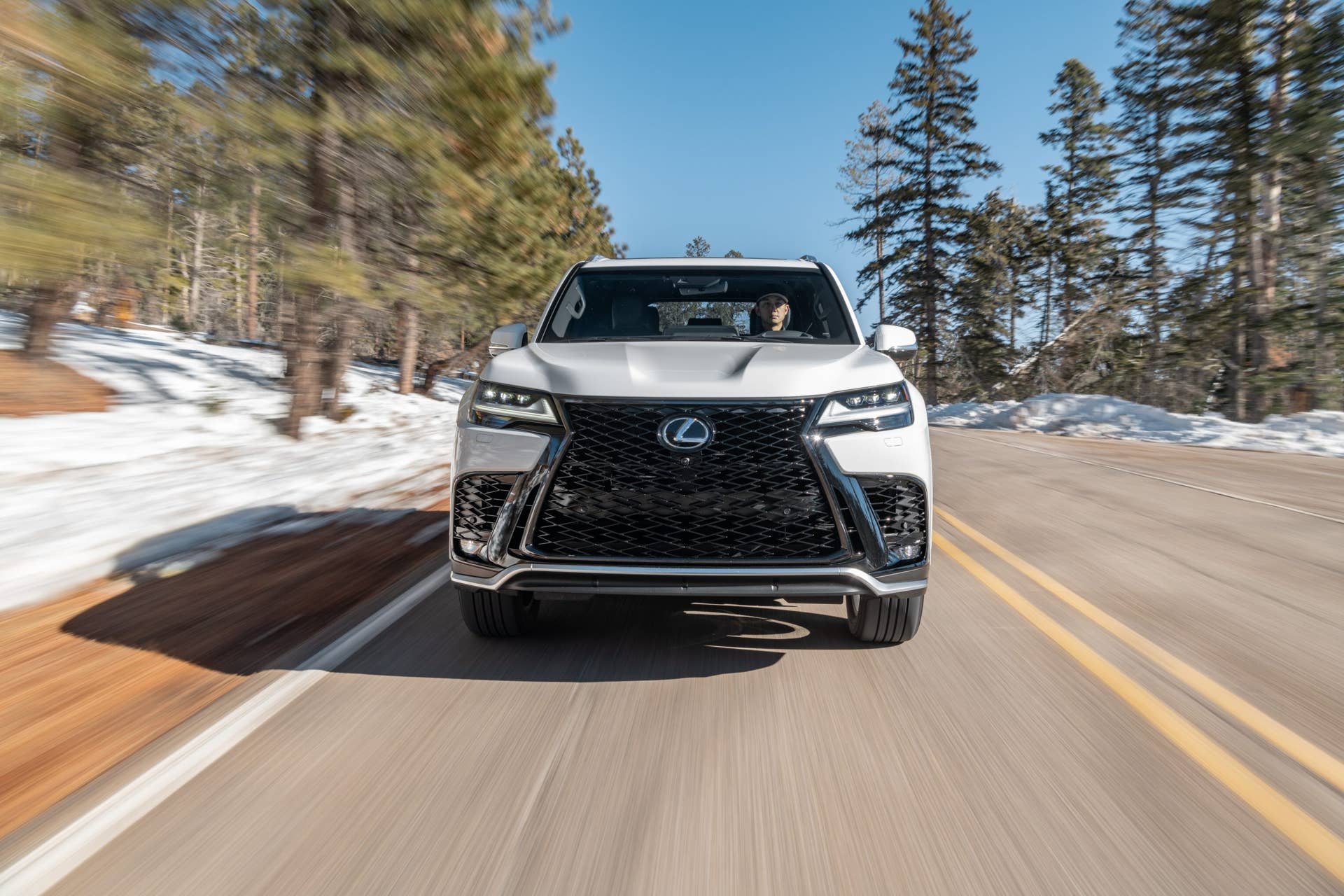 2025-2026 Lexus LX 600 F Sport in white front view driving