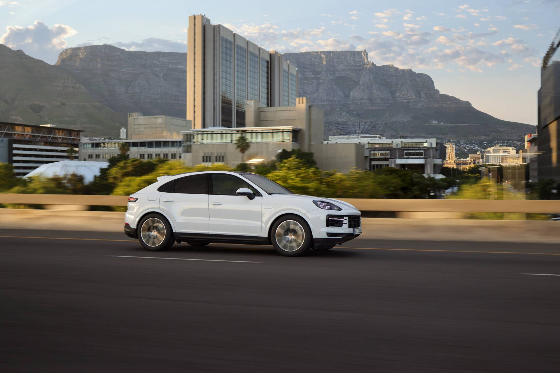 2025-2026 Porsche Cayenne Coupe in white side view driving