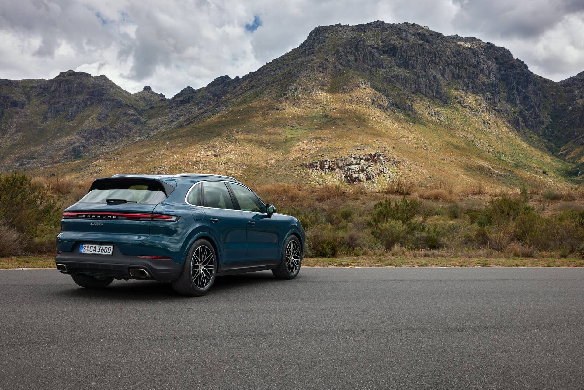 2025-2026 Porsche Cayenne SUV in turquoise rear angled view