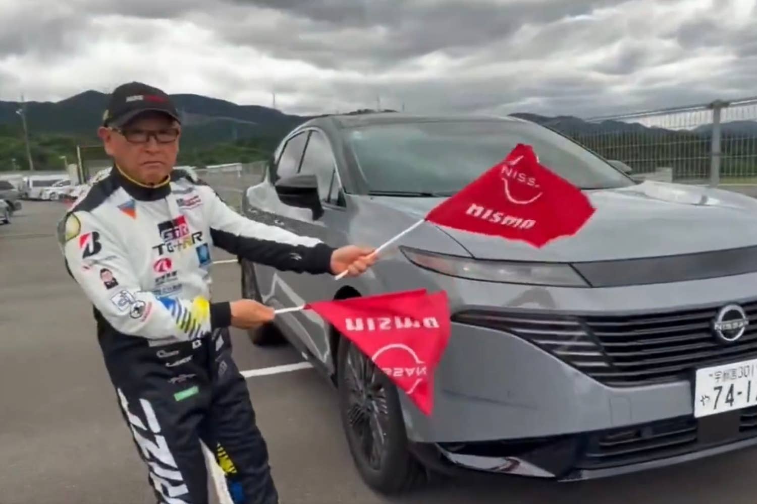 Akio Toyoda with the Nissan Murano