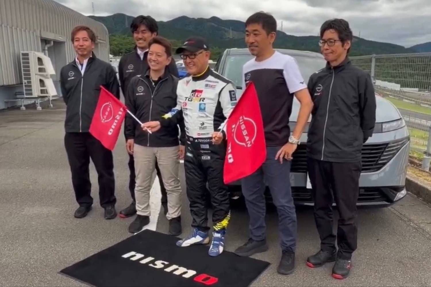 Akio Toyoda with the Nissan Murano