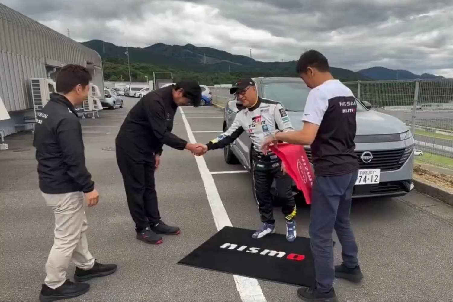Akio Toyoda with the Nissan Murano