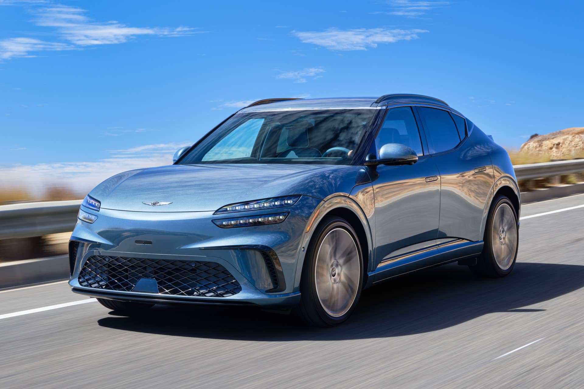 2026 Genesis GV60 blue front angled view driving