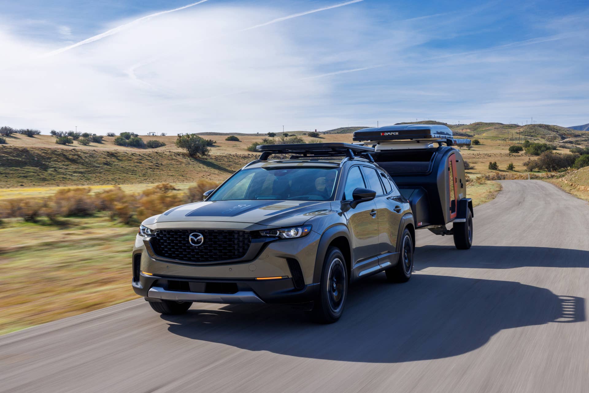 2025-2026 Mazda CX-50 Meridian Edition in Zircon Sand front angled view towing