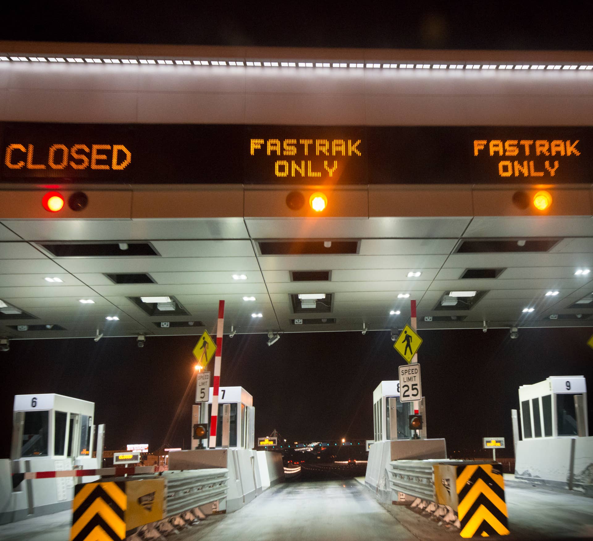 Driving through the Toll Plaza in the Fastrak lane at night.