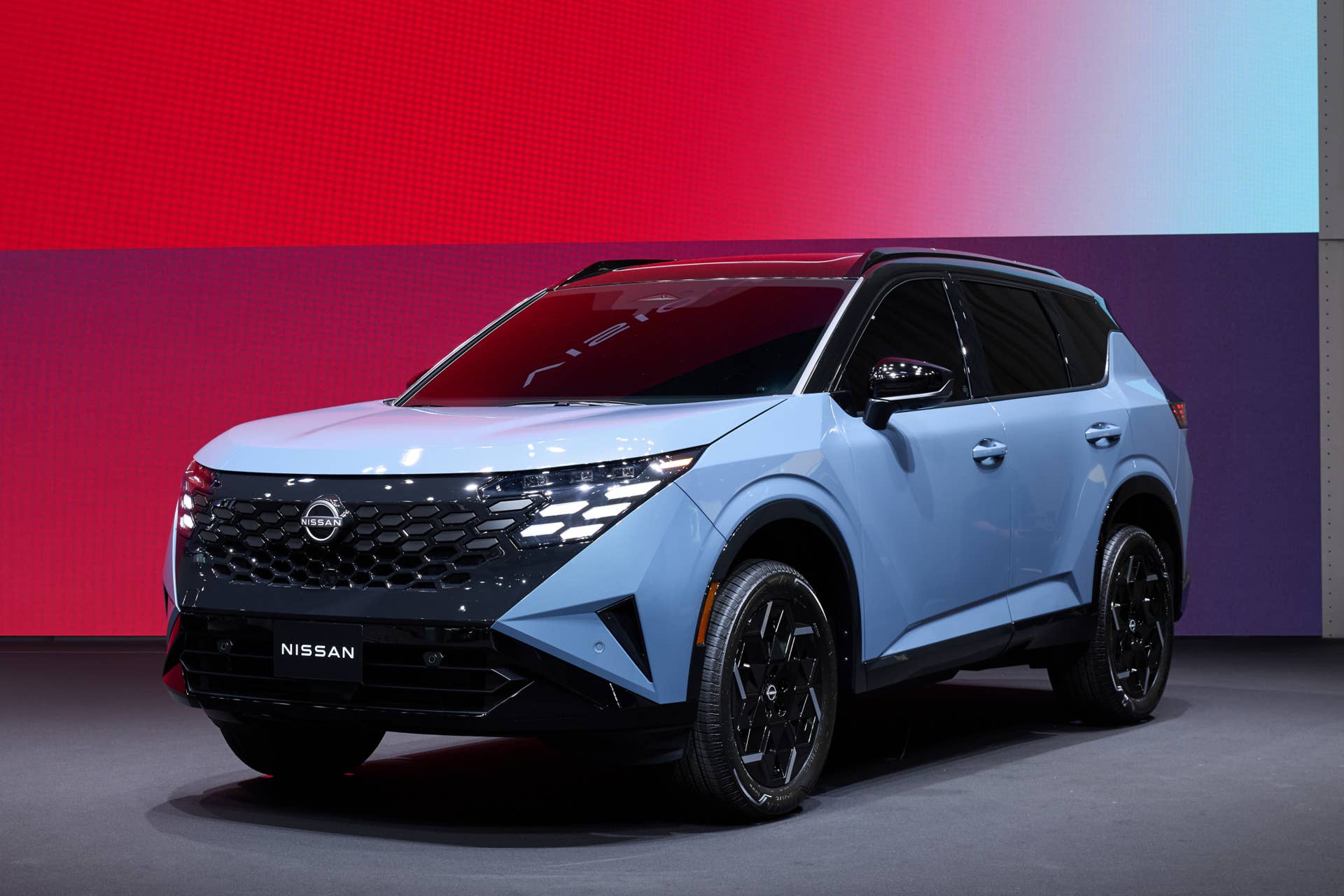 2027 Nissan Rogue Hybrid blue front angled view