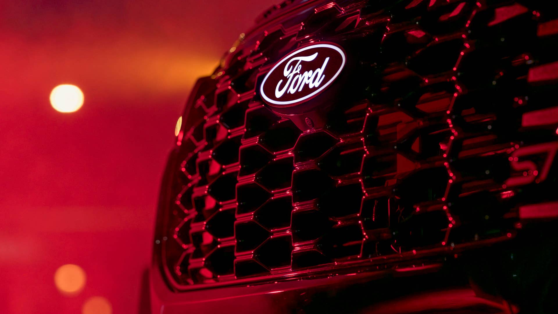 2027 Ford Explorer ST in black with Sinister package illuminated grille logo