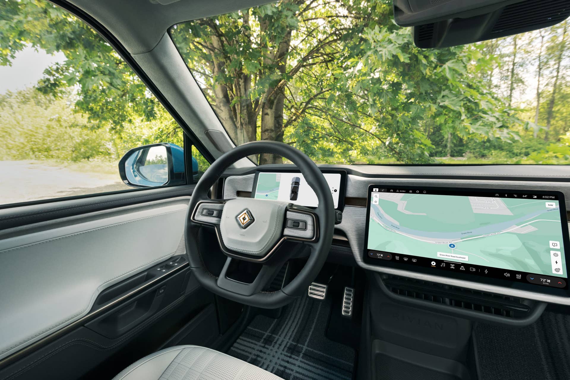 2025-2026 Rivian R1T black and white interior driver area