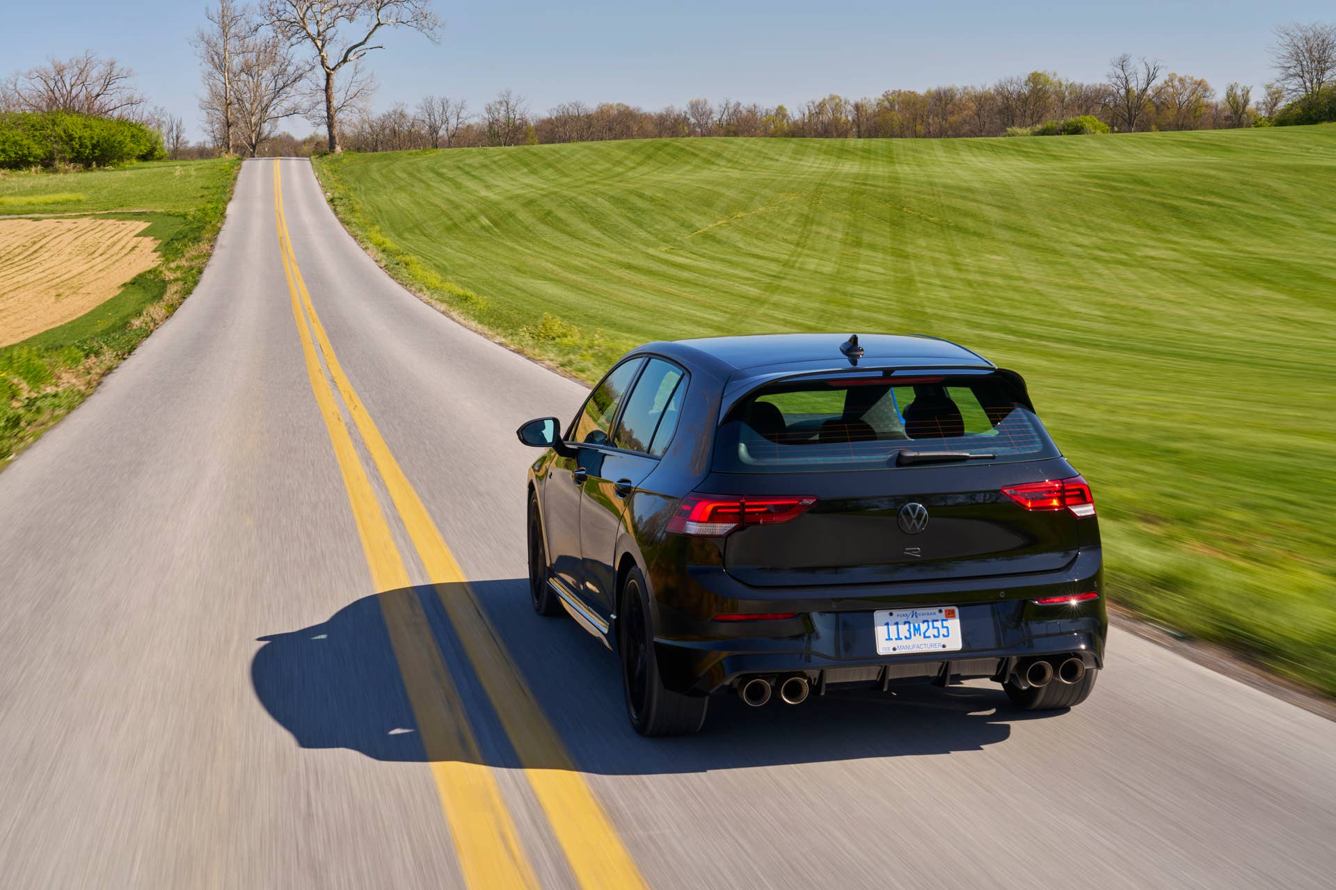2025-2026 Volkswagen Golf R in black rear view driving