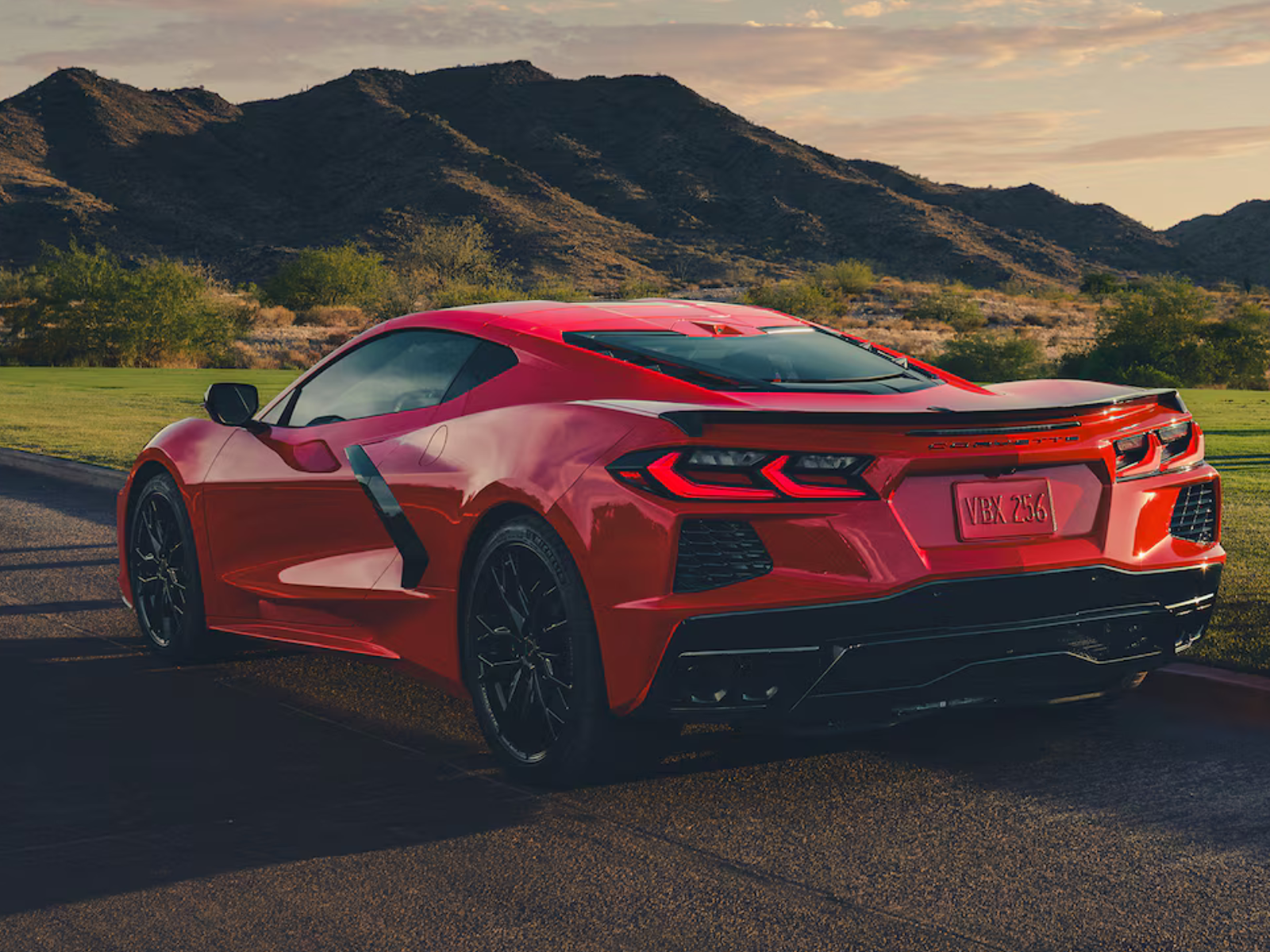 2027 Chevrolet Corvette Stingray in Red Mist Metallic Tintcoat rear angled view