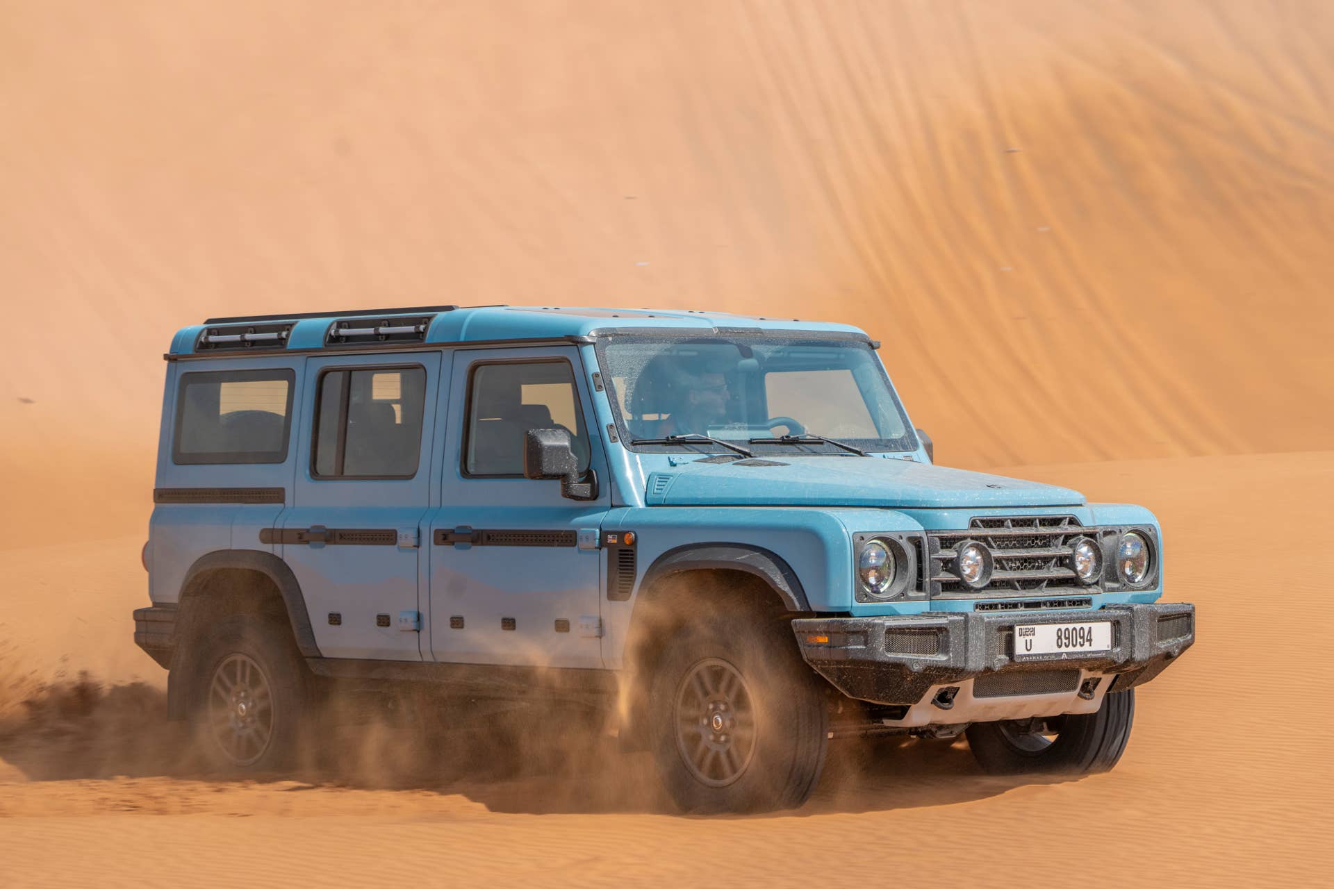 2025-2026 INEOS Grenadier Fieldmaster in Eldoret Blue front angled view sand driving