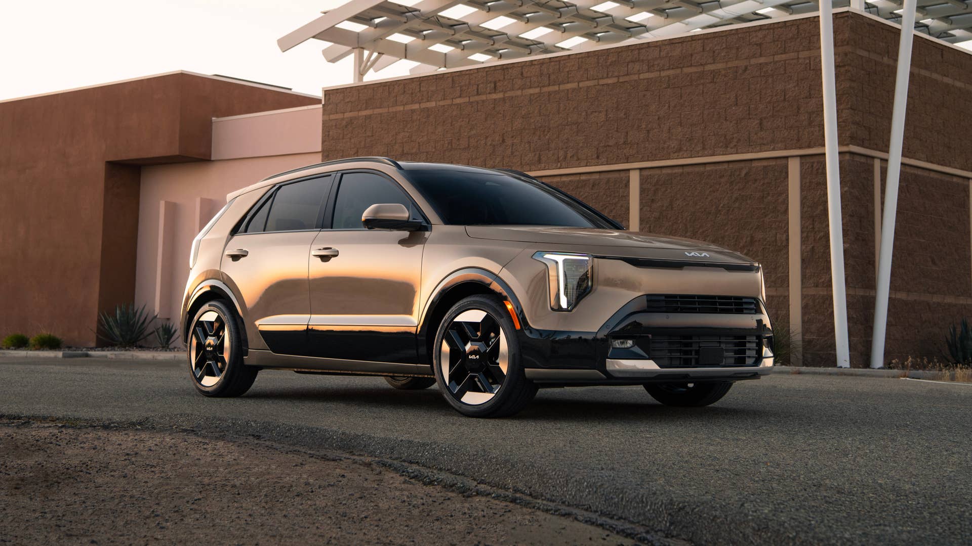 2027 Kia Niro SX Touring in Sunset Beige front angled view