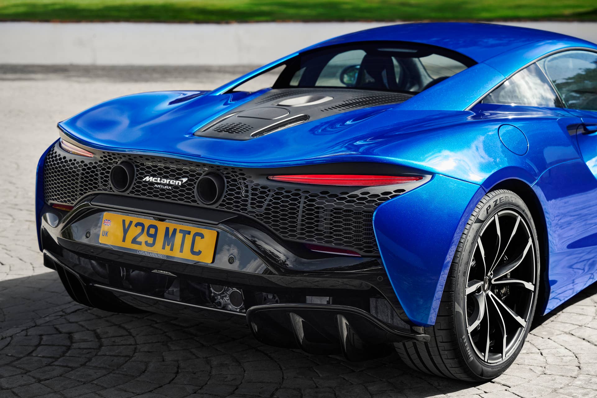 2025-2026 McLaren Artura Coupe in blue rear angled view