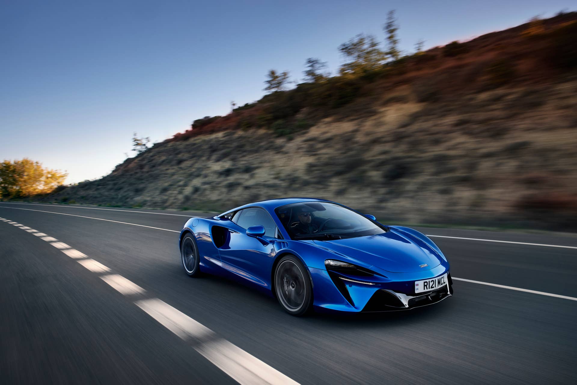 2025-2026 McLaren Artura Coupe in blue front angled view driving