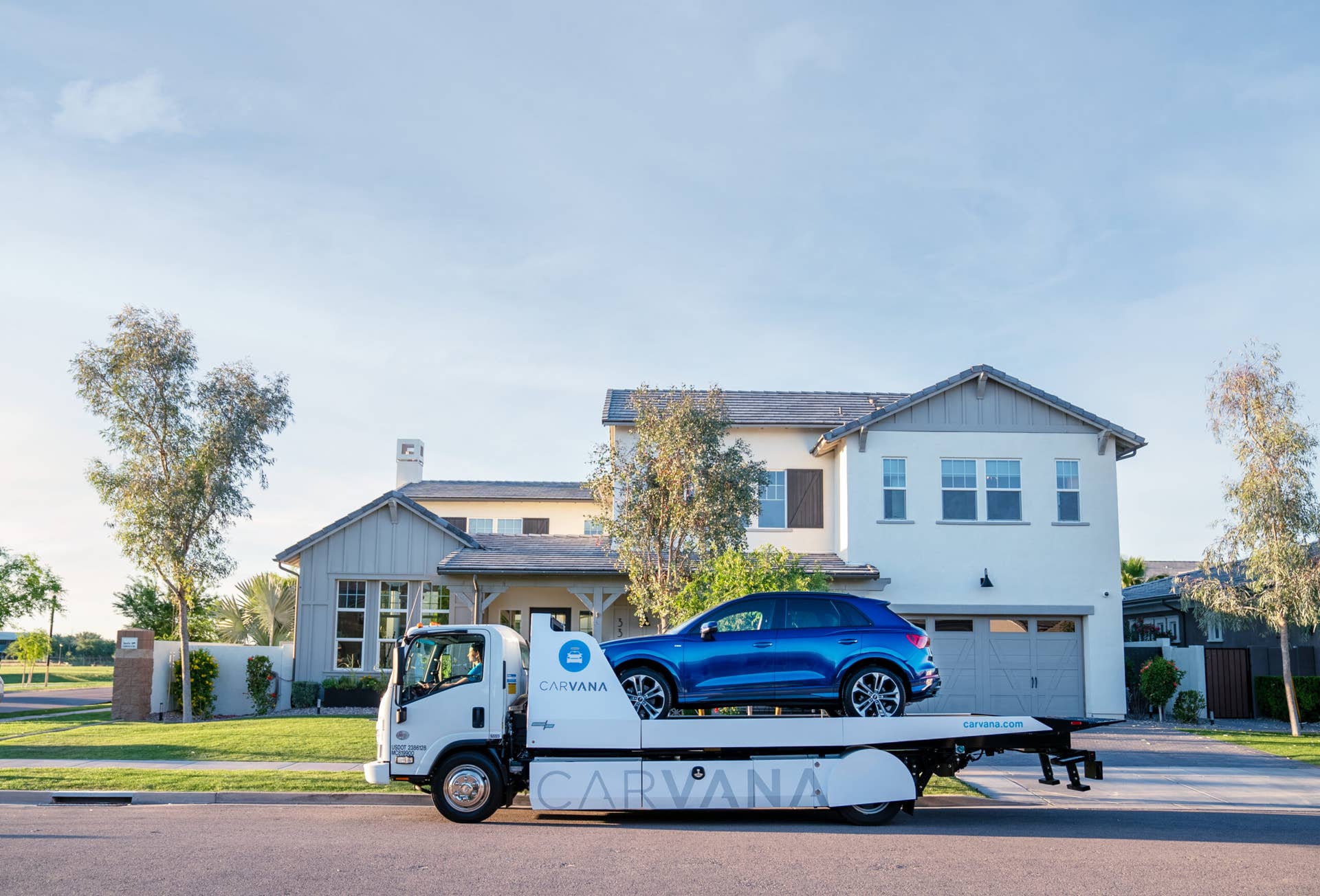 A vehicle being delivered to a customer who bought a car 100% online through Carvana