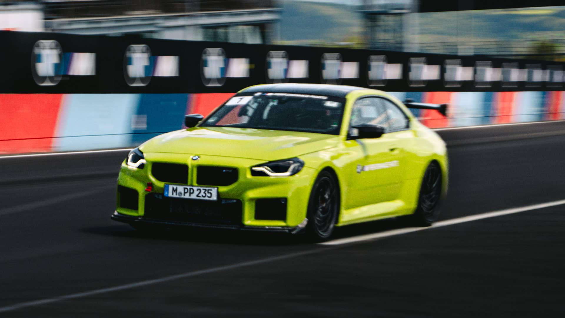 2027 BMW M2 in Sao Paulo Yellow with Track Pack front angled view driving