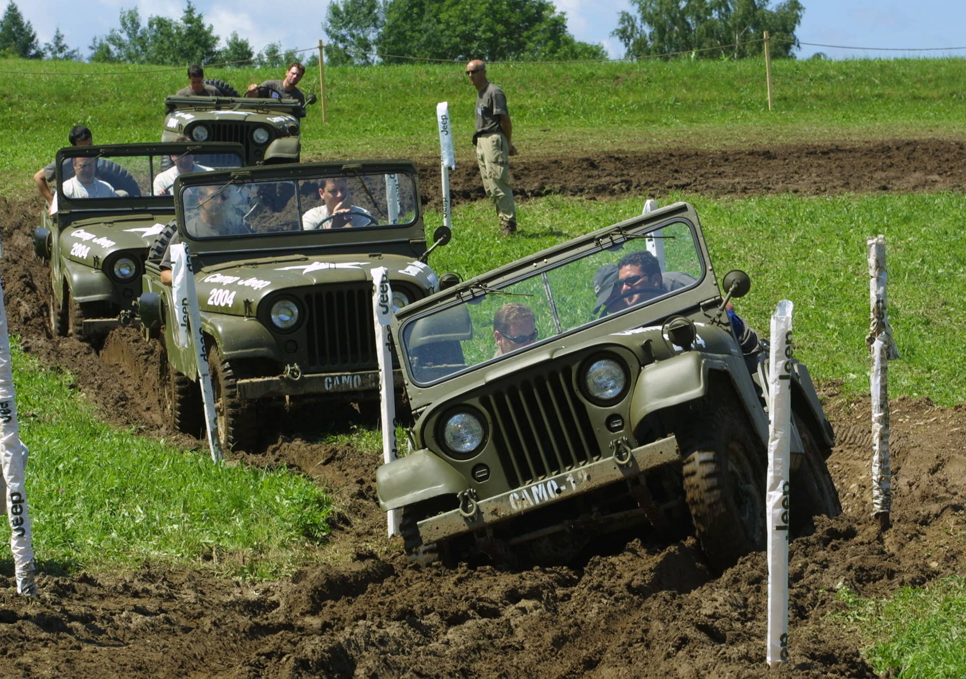 Historical military Jeep vehicles, made possible by Chrysler Austria, challenge the off-road courses at 2004 Euro Camp Jeep.