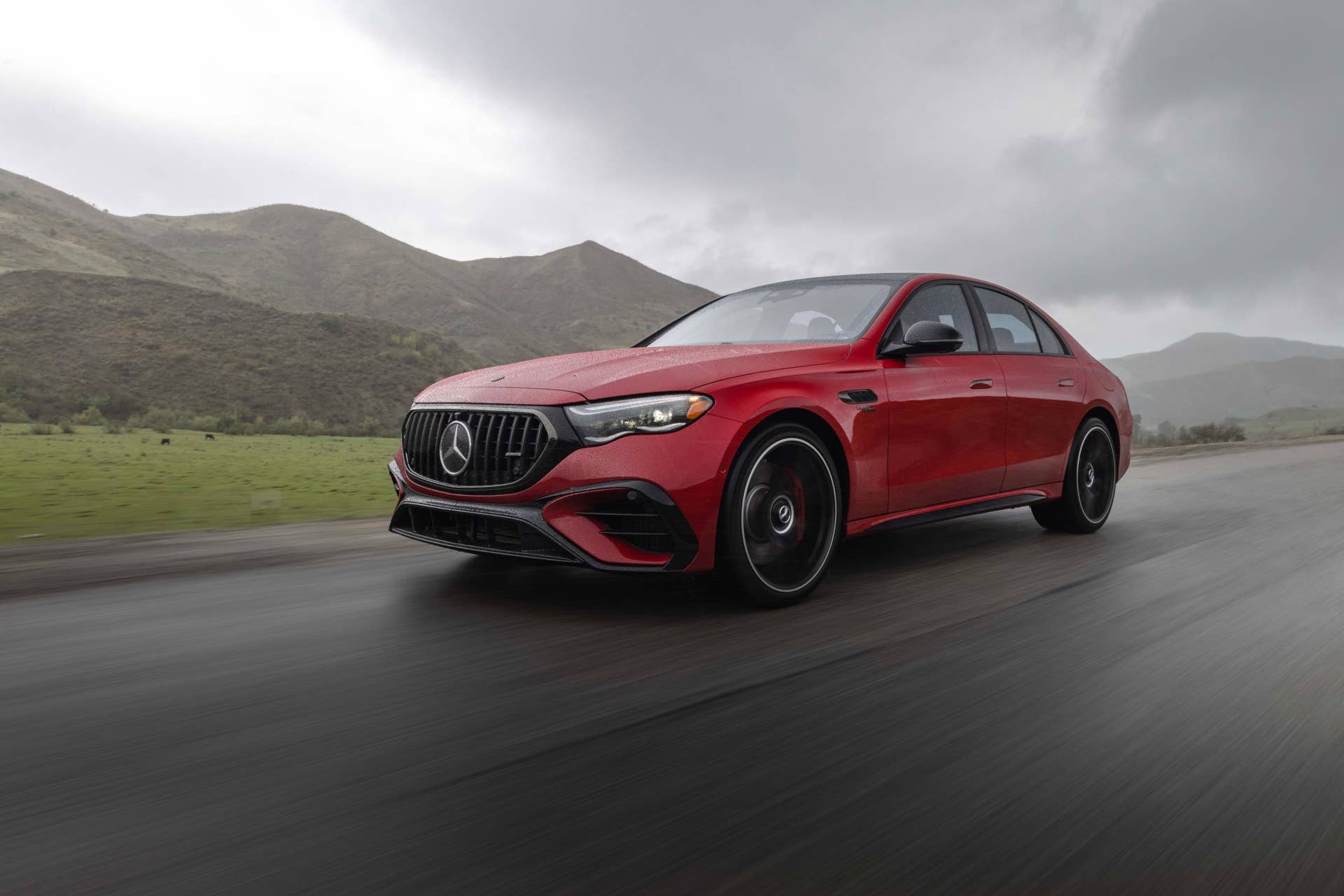 2026 Mercedes-AMG E 53 Sedan in Manufaktur Patagonia Red front angled view driving