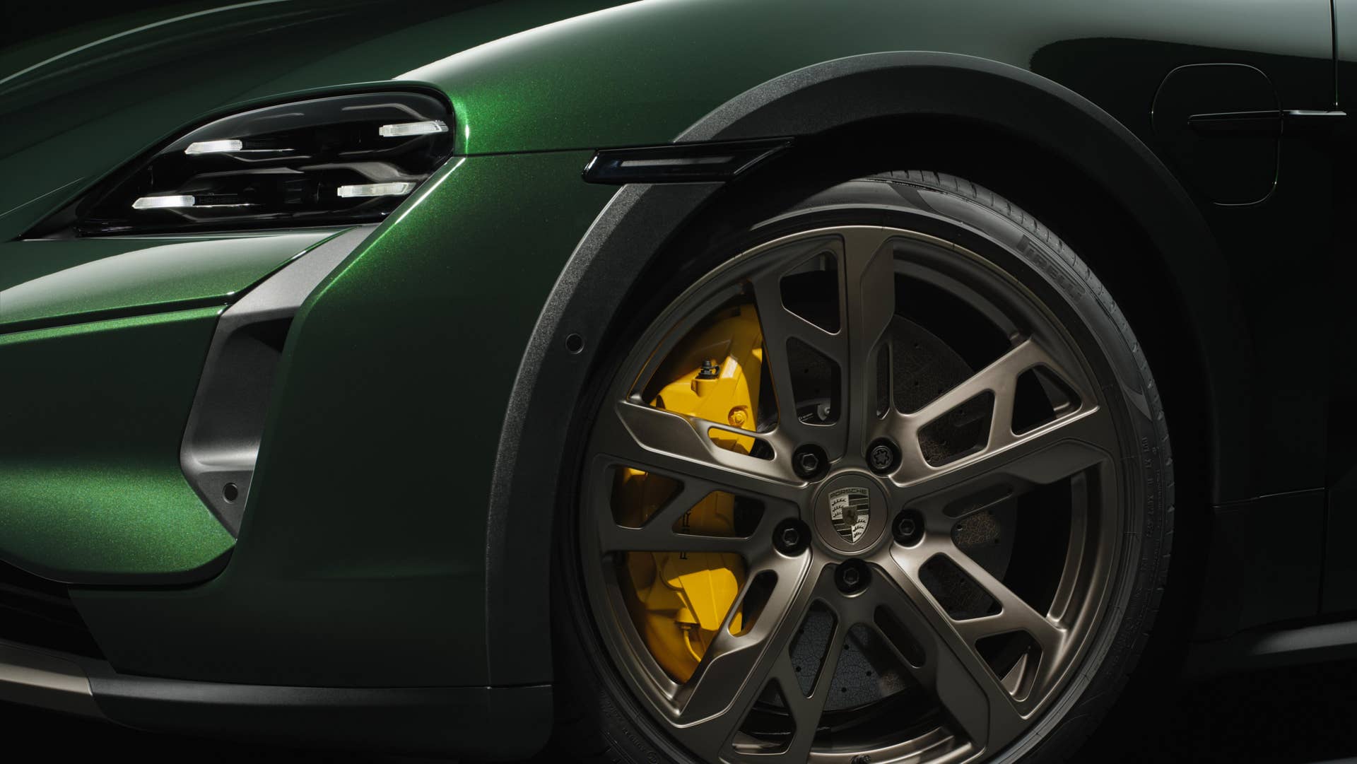 2026 Porsche Taycan Turbo Cross Turismo in green front wheel with yellow calliper