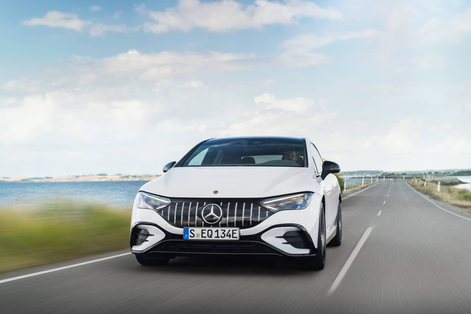 2025-2026 Mercedes-AMG EQE in white front view driving
