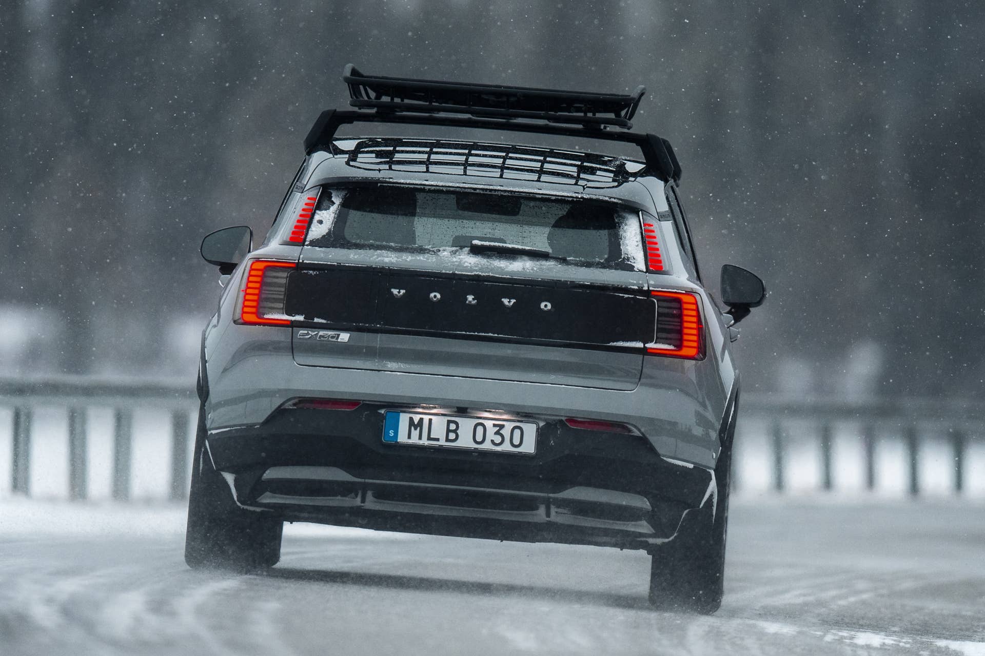 2026 Volvo EX30 Cross Country in gray rear view driving