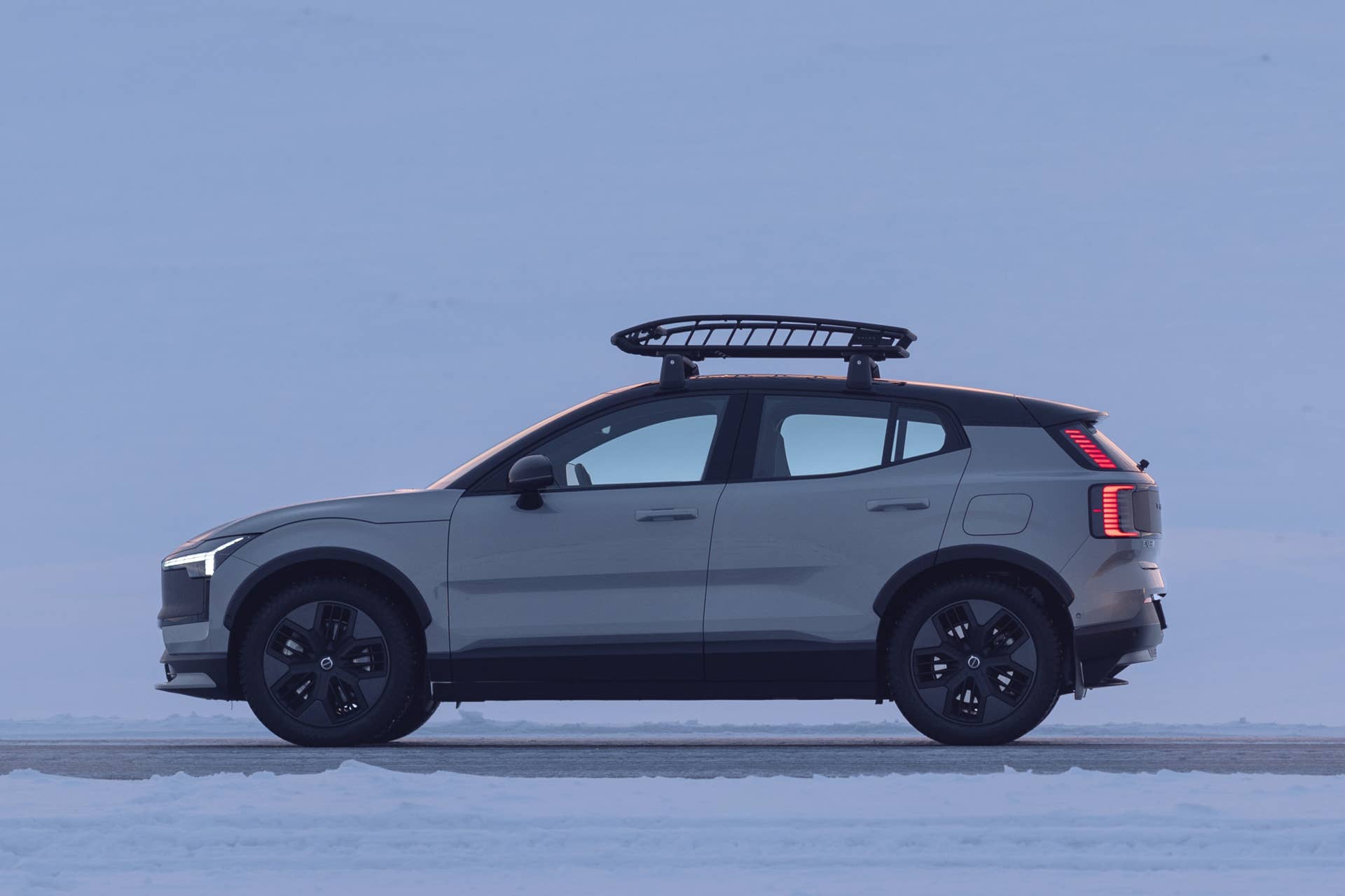 2026 Volvo EX30 Cross Country in gray side view on snow