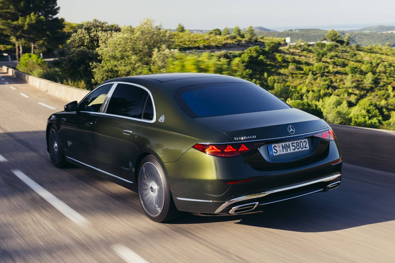 2027 Mercedes-Maybach S-Class rear angled view driving