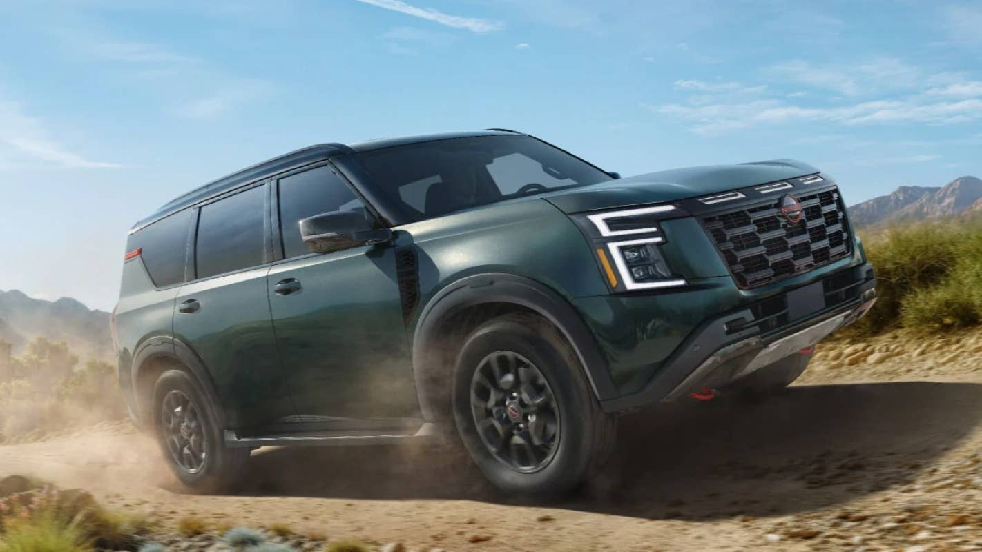 2026 Nissan Armada Pro-4X in Alpine Metallic front angled view off-road driving