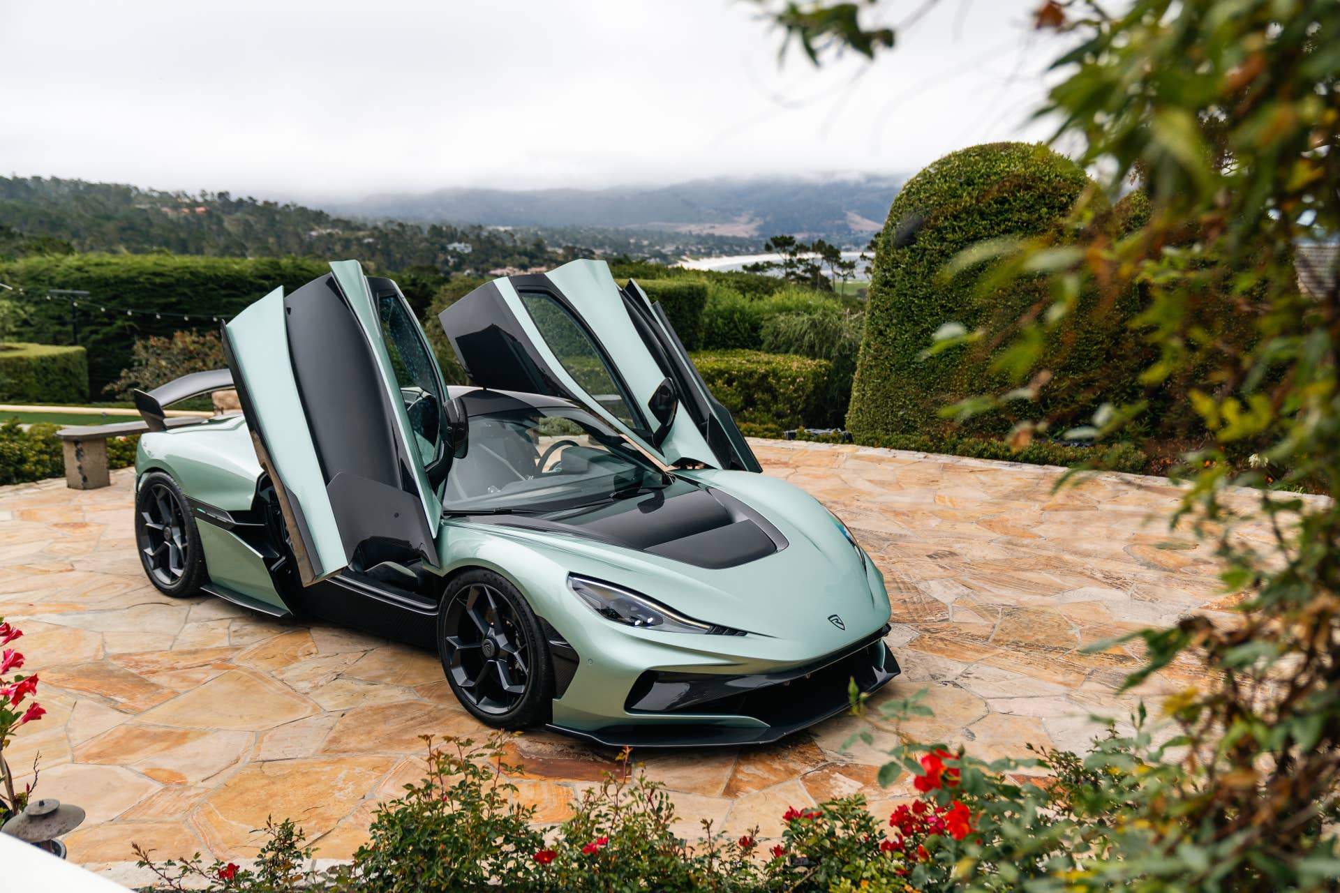 2025-2026 Rimac Nevera in green high front angled view doors open
