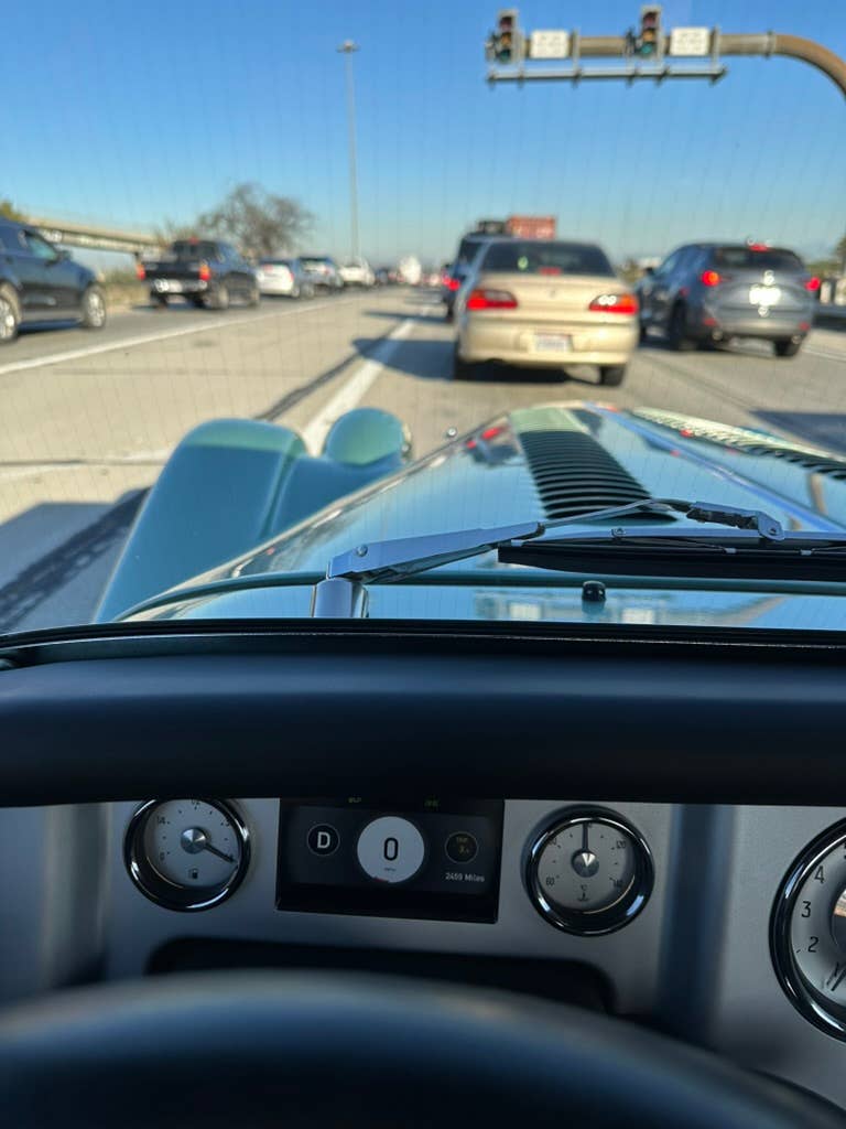 The view of the Morgan Plus Four's bonnet while sitting in LA traffic.