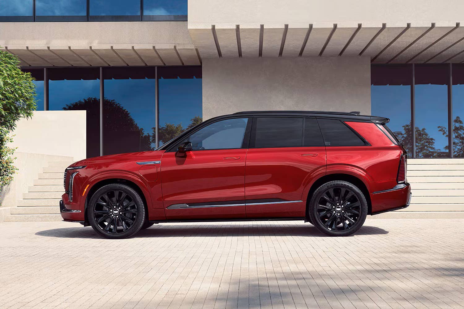 2027 Cadillac Vistiq Platinum in Radiant Red Tintcoat side view