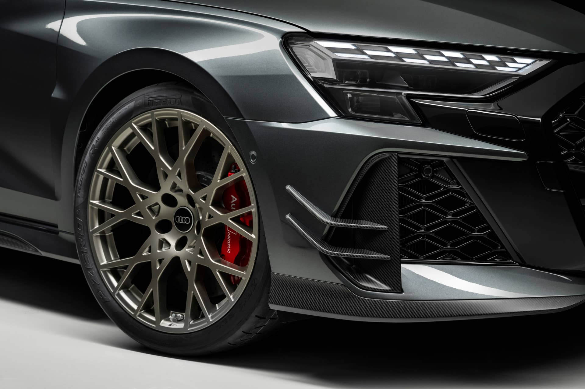 2027 Audi RS3 Competition Limited front angled view closeup wheel and canards