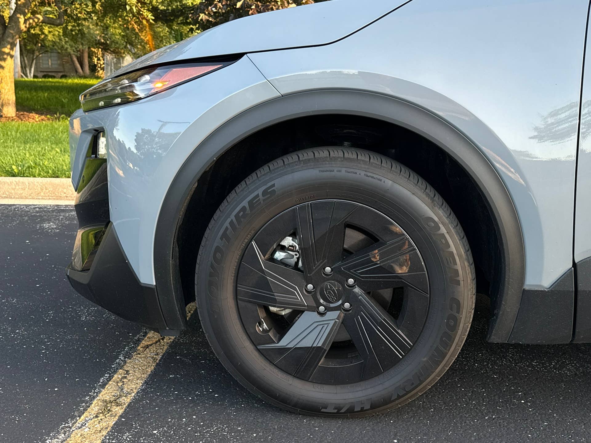 2026 Subaru Uncharted Sport AWD driving on rural road during review